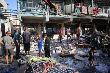 Palestinians check the grounds of a school after an Israeli airstrike in Nuseirat, Gaza Strip, on September 11, 2024.