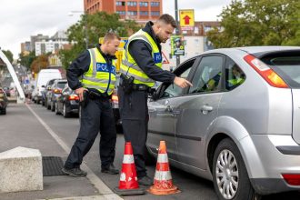 German federal police check cars arriving at the German-Polish border on September 10.