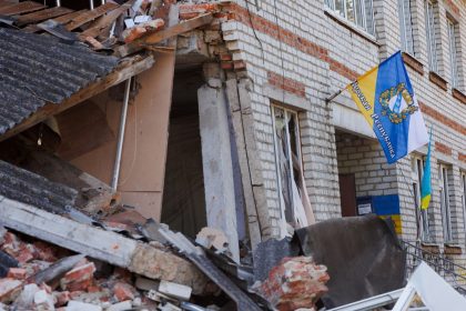 A flag with the coat of arms of the Kursk region is placed on a damaged building on September 10, 2024 in Sudzha, Kursk Region, Russia.