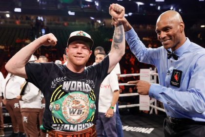 LAS VEGAS, NEVADA - SEPTEMBER 14: WBC/WBA/WBO super middleweight champion Canelo Alvarez poses for a photo with referee Harvey Dock after Alvarez's won a title fight by unanimous decision against Edgar Berlanga, not pictured, at T-Mobile Arena on September 14, 2024 in Las Vegas, Nevada. (Photo by Steve Marcus/Getty Images)