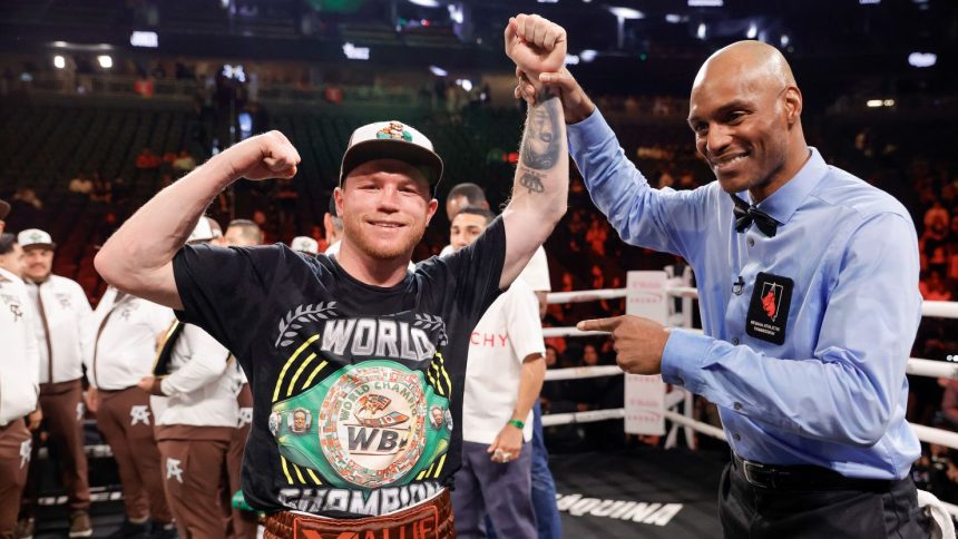 LAS VEGAS, NEVADA - SEPTEMBER 14: WBC/WBA/WBO super middleweight champion Canelo Alvarez poses for a photo with referee Harvey Dock after Alvarez's won a title fight by unanimous decision against Edgar Berlanga, not pictured, at T-Mobile Arena on September 14, 2024 in Las Vegas, Nevada. (Photo by Steve Marcus/Getty Images)