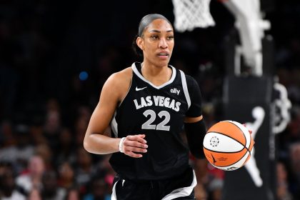 Aces center A'ja Wilson dribbles the ball during the game against the Seattle Storm.