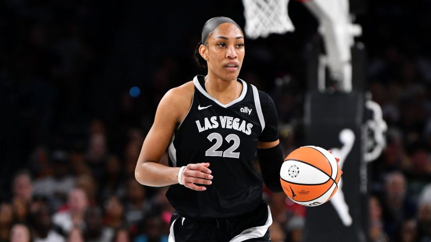 Aces center A'ja Wilson dribbles the ball during the game against the Seattle Storm.