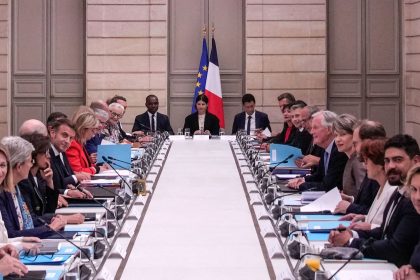 French President Emmanuel Macron (center left) and French Prime Minister Michel Barnier (center right) meet with members of the new government during the weekly cabinet meeting at the Elysee Palace, in Paris, on September 23.