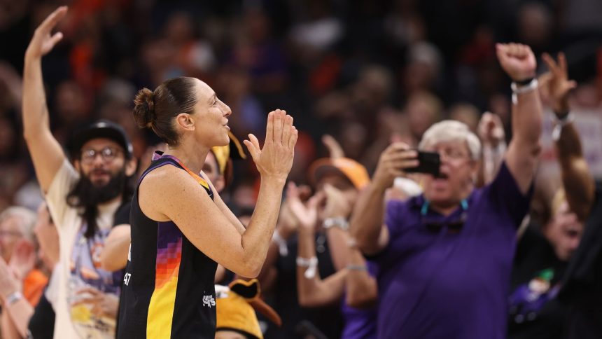 Diana Taurasi reacts to fans cheering as she checks back into the second half against the Seattle Storm at Footprint Center on September 19 in Phoenix, Arizona.