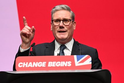 Prime Minister Keir Starmer gestures as he delivers his keynote speech during the Labour Party conference on September 24, 2024 in Liverpool, England.