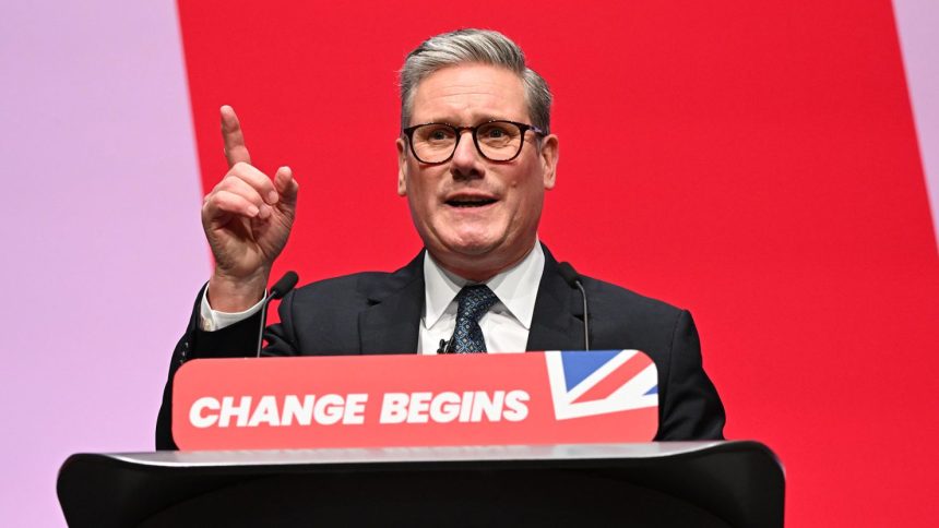 Prime Minister Keir Starmer gestures as he delivers his keynote speech during the Labour Party conference on September 24, 2024 in Liverpool, England.