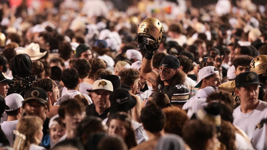 Colorado's Yahya Attia celebrates with fans after the Buffaloes defeated the Baylor Bears in overtime.