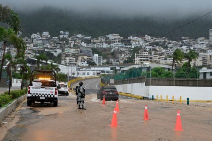 Security forces stands guard on a flooded road after Hurricane John in Acapulco, Mexico on September 26, 2024.