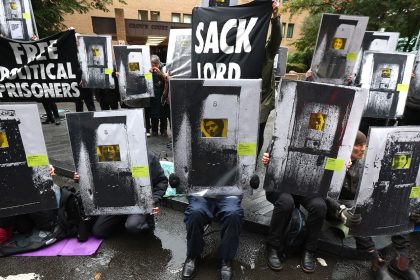 Supporters of Phoebe Plummer and Anna Holland from Just Stop Oil protest in front of Southwark Crown Court on September 27, 2024 in London, England.