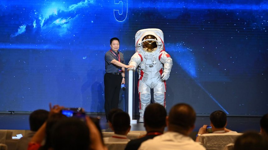 Yang Liwei, deputy chief designer of China's manned space program, unveils China's moon-landing spacesuit on September 28, 2024 in the southwestern metropolis of Chongqing.