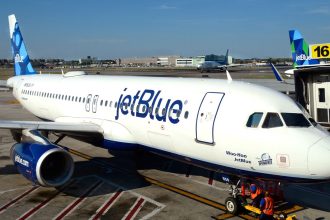 A JetBlue Airways plane is serviced at a gate at John F. Kennedy International Airport in a file photo.