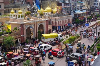 Sis Ganj Gurudwara, a holy place of worship for Sikhs, on the left, followed by the Golden (Sunehri) Mosque pictured in Chandni Chowk, Old Delhi, India.