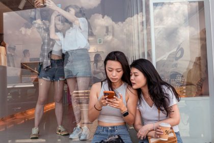 Chinese tourists in Hong Kong's Kennedy Town district take pictures at a cafe that has become incredibly popular thanks to the Xiaohongshu social media app.