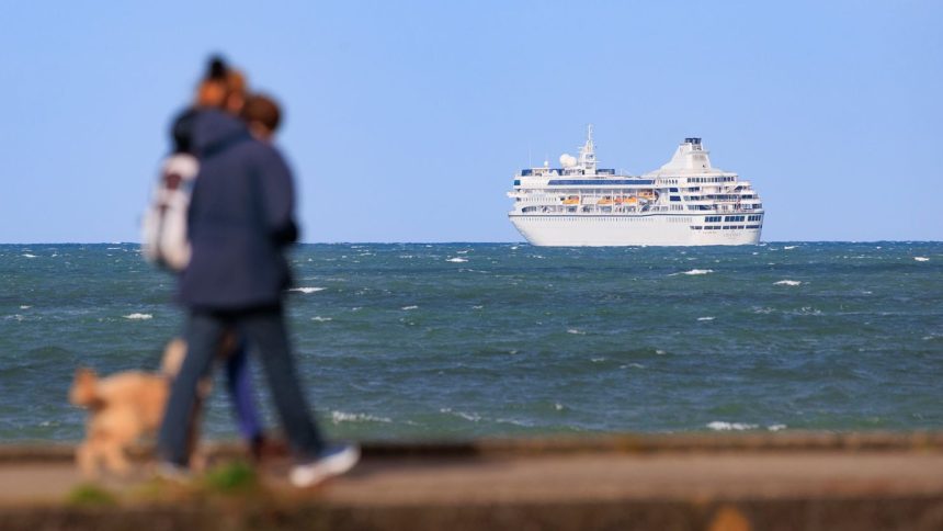 Villa Vie Odyssey, which was originally scheduled to set off in May, is currently anchored off the coast of Bangor, Northern Ireland.