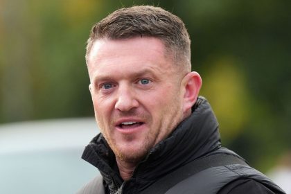 Political activist Tommy Robinson outside Folkestone Police Station on Friday.