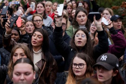 Fans sing at a memorial for former One Direction singer Liam Payne, who was found dead after he fell from a third-floor hotel room balcony in Buenos Aires, in Hyde Park, London, Britain, October 20, 2024.