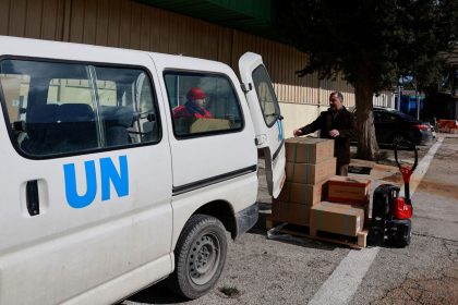 UNRWA workers transport boxes of humanitarian aid at the West Bank field office complex of UNRWA, in the Sheikh Jarrah neighborhood of East Jerusalem, on January 30, 2024.