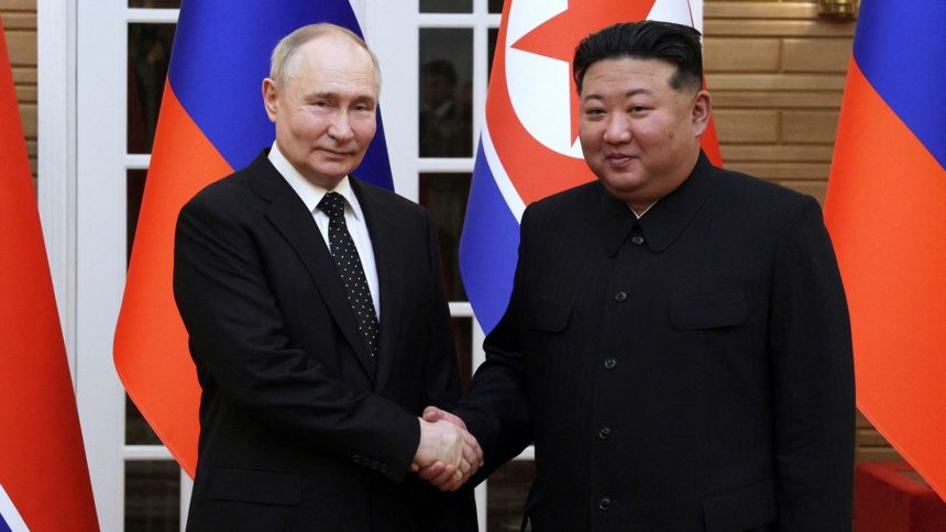 Russia's President Vladimir Putin and North Korea's leader Kim Jong Un shake hands in Pyongyang, North Korea June 19, 2024.