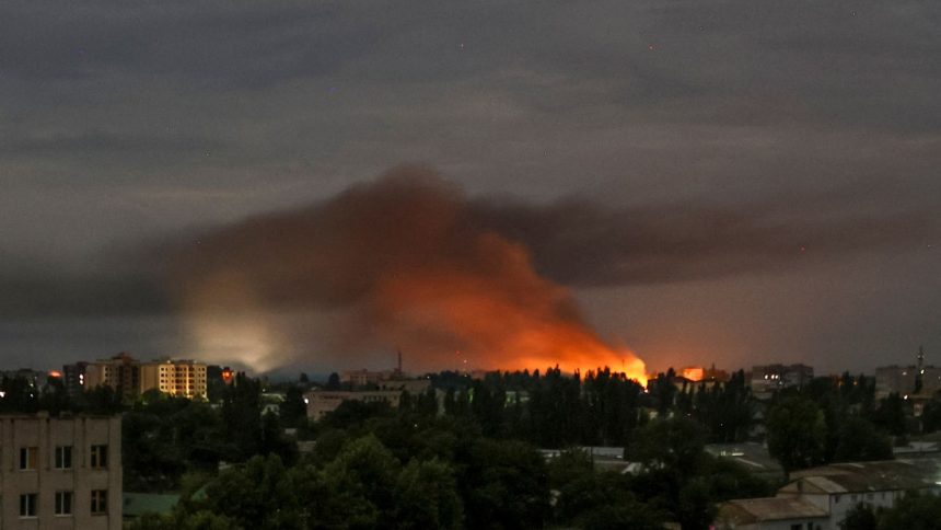 Smoke rises during a Russian drone strike on the city of Kherson on July 26, 2024.