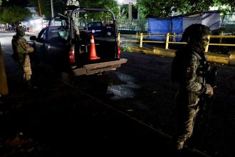 Soldiers stand guard outside a hospital where injured migrants were taken after Mexican soldiers shot a group of 33 migrants in Tapachula, Mexico. October 2, 2024.