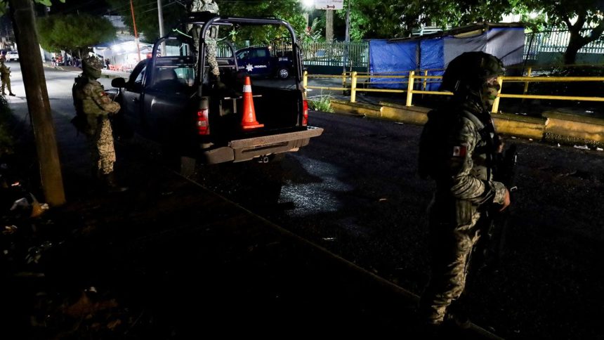 Soldiers stand guard outside a hospital where injured migrants were taken after Mexican soldiers shot a group of 33 migrants in Tapachula, Mexico. October 2, 2024.