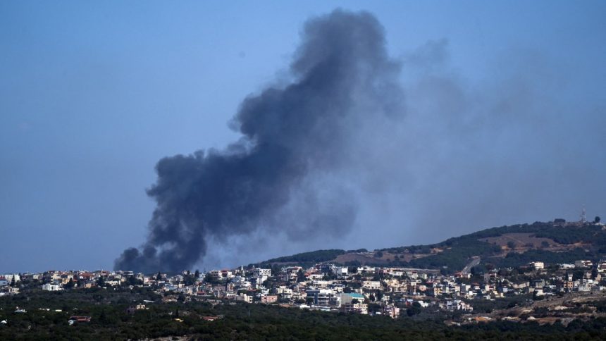 Smoke rises from southern Lebanon following Israeli strikes, amid cross-border hostilities between Hezbollah and Israel, as seen from northern Israel, October 8, 2024.