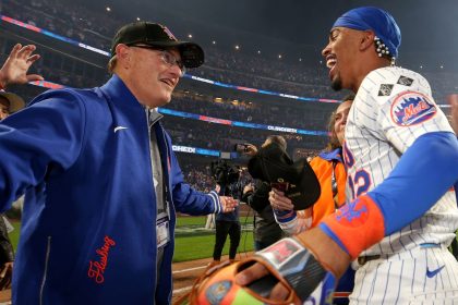 New York Mets owner Steve Cohen celebrates with shortstop Francisco Lindor after defeating the Philadelphia Phillies in game four of the NLDS.