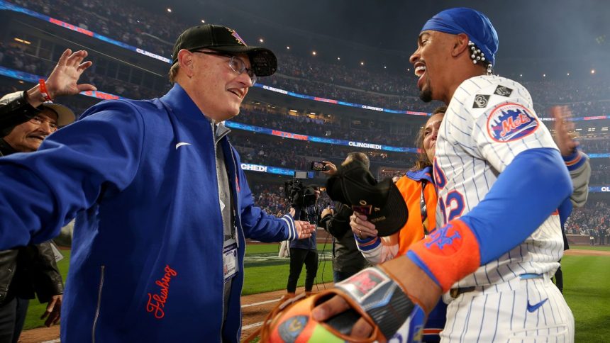 New York Mets owner Steve Cohen celebrates with shortstop Francisco Lindor after defeating the Philadelphia Phillies in game four of the NLDS.