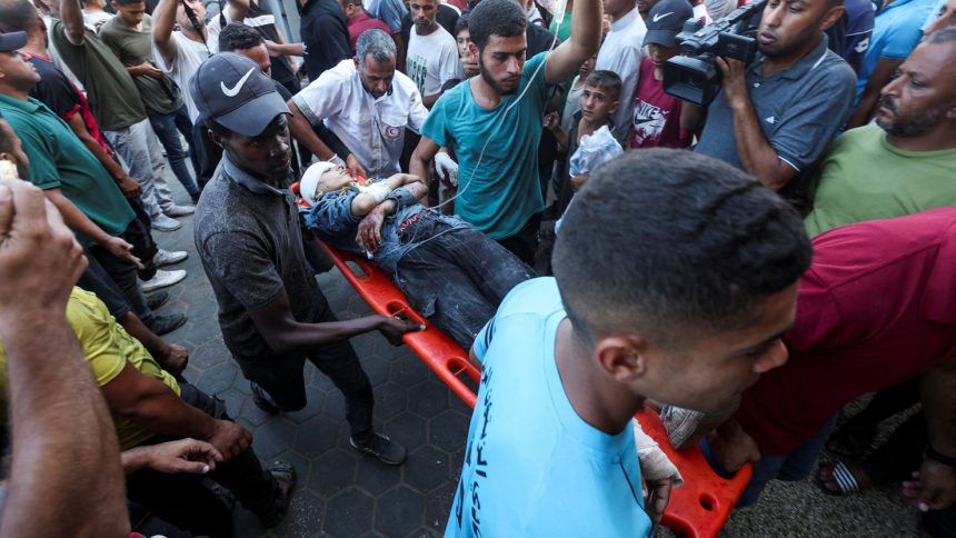 A wounded Palestinian is carried to Al-Aqsa Martyrs Hospital, in the aftermath of an Israeli strike amid the Israel-Hamas conflict, in Deir Al-Balah, central Gaza Strip on Thursday.