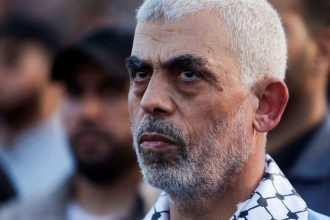 FILE PHOTO: Hamas leader Yahya Sinwar looks on as Palestinian Hamas supporters take part in an anti-Israel rally over tension in Jerusalem's Al-Aqsa mosque, in Gaza City October 1, 2022. REUTERS/Mohammed Salem/File Photo