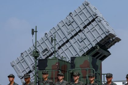 Members of the Taiwanese Navy Hai Feng (Sea Blade) Group stand in front of Hsiung Feng III mobile missile launcher during Taiwanese President Lai Ching-te’s visit to the base in response to recent Chinese military drills, in Taoyuan, Taiwan October 18, 2024.