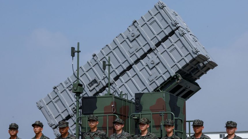 Members of the Taiwanese Navy Hai Feng (Sea Blade) Group stand in front of Hsiung Feng III mobile missile launcher during Taiwanese President Lai Ching-te’s visit to the base in response to recent Chinese military drills, in Taoyuan, Taiwan October 18, 2024.