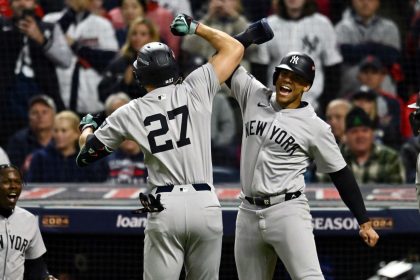 Oct 18, 2024; Cleveland, Ohio, USA; New York Yankees designated hitter Giancarlo Stanton (27) celebrates with outfielder Juan Soto (22) after hitting a three run home run in the sixth inning against the Cleveland Guardians during game four of the ALCS for the 2024 MLB playoffs at Progressive Field. Mandatory Credit: Ken Blaze-Imagn Images