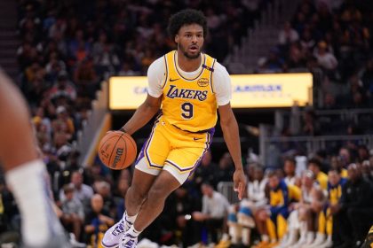 Oct 18, 2024; San Francisco, California, USA; Los Angeles Lakers guard Bronny James (9) dribbles the ball against the Golden State Warriors in the second quarter at the Chase Center. Mandatory Credit: Cary Edmondson-Imagn Images