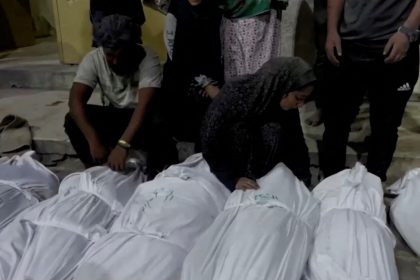 Mourners react next to the bodies of Palestinians killed in Israeli strikes at Kamal Adwan hospital in Jabalia, in the northern Gaza Strip in this still image taken from a video on Sunday.