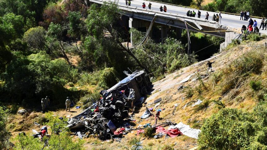 Authorities work on the site of a passenger bus accident where several people died while traveling on a highway from Nayarit to Chihuahua, in Piedra Gorda, Mexico, on October 26, 2024.