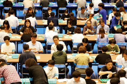 Election officers count ballots for the general election at a ballot counting centre in Tokyo on Sunday.