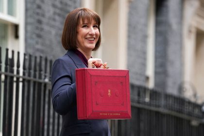 Britain's finance minister Rachel Reeves poses with the red budget box outside her office in Downing Street in London on October 30, 2024.