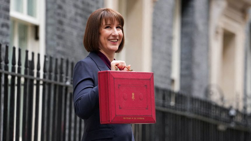 Britain's finance minister Rachel Reeves poses with the red budget box outside her office in Downing Street in London on October 30, 2024.