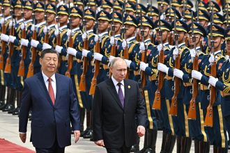 Russia's President Vladimir Putin and China's President Xi Jinping attend an official welcoming ceremony in front of the Great Hall of the People in Tiananmen Square in Beijing on May 16, 2024.