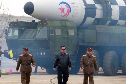 In this photo distributed by the North Korean government, North Korean leader Kim Jong Un walks around what it says is a Hwasong-17 intercontinental ballistic missile (ICBM) on the launcher, at an undisclosed location in North Korea on March 24, 2022.