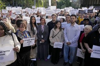 ABC workers and other supporters gather at its Sydney office on May 22, 2023 to support Indigenous Australian journalist Stan Grant, who quit anchoring after viewers responded with racist abuse to his comments during King Charles III's coronation about historic Aboriginal dispossession.