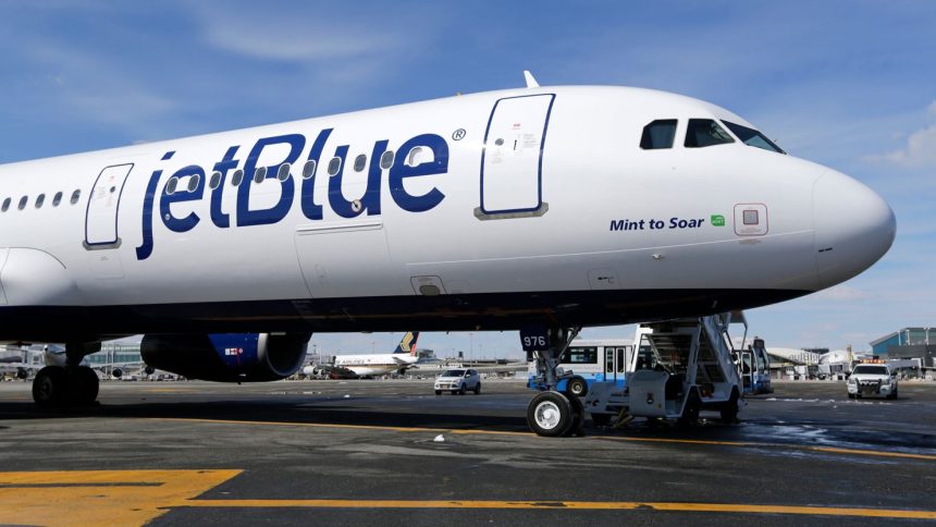 A JetBlue airplane sits on the tarmac at John F. Kennedy International Airport in New York in 2017.