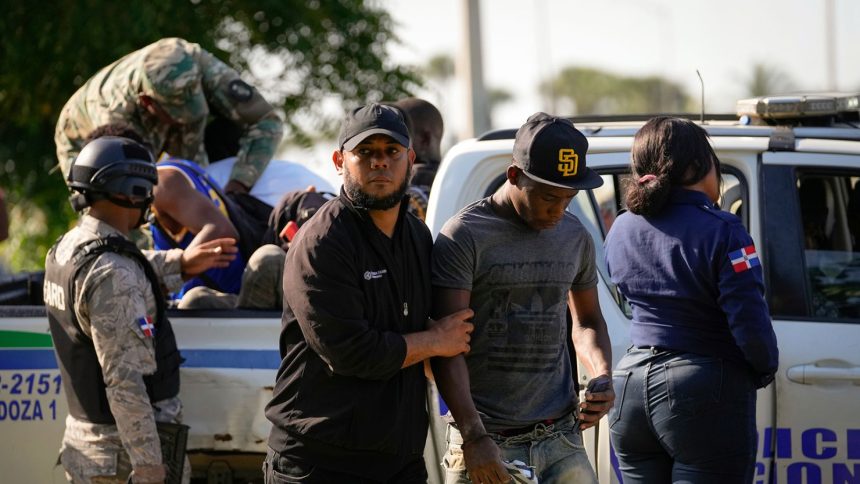 Migration officials detain undocumented Haitians in Santo Domingo, Dominican Republic, Thursday, May 16, 2024.