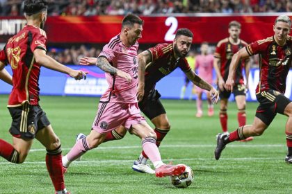 Lionel Messi takes on the Atlanta United defense during an MLS match at Mercedes-Benz Stadium.