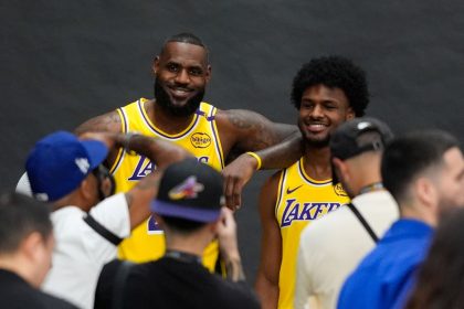 Los Angeles Lakers' LeBron James, left, and his son, Bronny James, could make history Tuesday as first father-son duo to play together in a regular season NBA game.