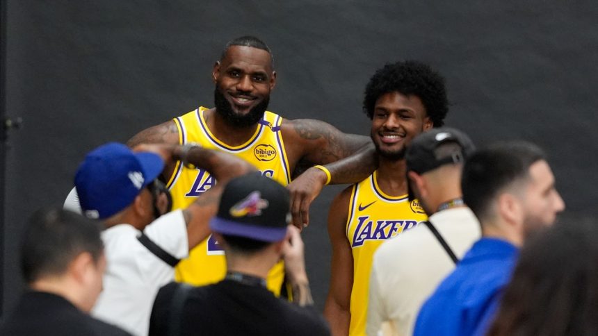 Los Angeles Lakers' LeBron James, left, and his son, Bronny James, could make history Tuesday as first father-son duo to play together in a regular season NBA game.