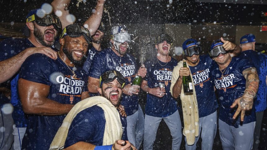 The New York Mets celebrate in the locker room after clinching a playoff berth with their come-from-behind victory against the Atlanta Braves.