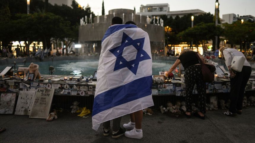 People look at a memorial for victims of the cross-border attack by Hamas militants on the one-year anniversary in Tel Aviv, Israel, on October 7, 2024.